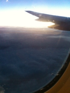 Sun over the clouds, almost home.